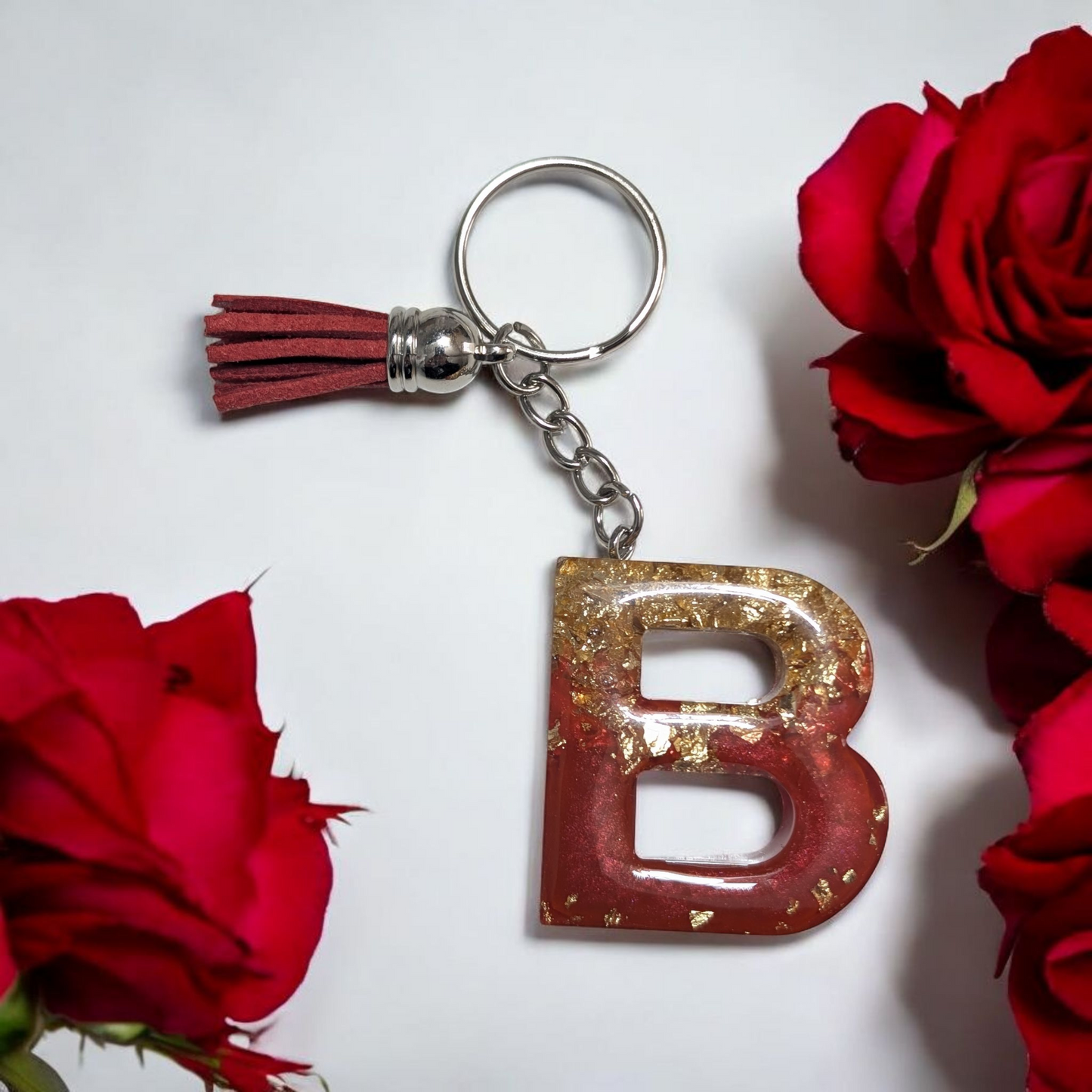 Porte-clés lettre rouge et feuille d'or